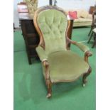 Victorian mahogany carved framed upholstered open armchair with spoon back on casters. Estimate £