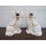 A pair of Royal Doulton white Staffordshire-type dogs. Estimate £20-30