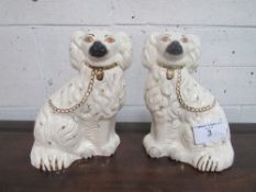 A pair of Royal Doulton white Staffordshire-type dogs. Estimate £20-30