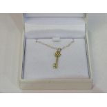 'Aray' Jewellers 9ct gold necklace with stone set key pendant, new, in box. Estimate £20-40