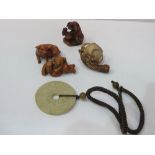 2 Netsuki's: a Japanese dog figurine & a cream coloured stone necklace & a small Meerschaum pipe.