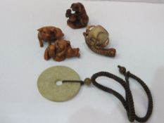 2 Netsuki's: a Japanese dog figurine & a cream coloured stone necklace & a small Meerschaum pipe.