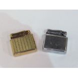 2 stainless steel & gold plated Colibri 1930's petrol lighters. Estimate £15-25