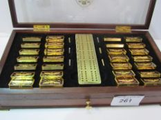 Set of Franklin Mint 'Imperial Dominoes by The House of Fabergé', in wooden case. Estimate £150-200