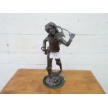 Bronzed figurine of a boy carrying a basket over his shoulder, height 34cms. Estimate £20-40