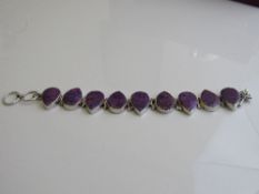 Silver hallmarked bracelet with tear drop purple stones. Estimate £20-30