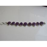 Silver hallmarked bracelet with tear drop purple stones. Estimate £20-30