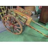 Italian donkey cart. A very decorative continental cart painted with a base colour of dark red and