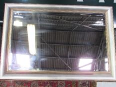 Silver coloured framed bevel edged wall mirror, 72cms x 102cms. Estimate £30-40