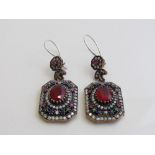 925 silver earring set with central red stones surrounded by other coloured stones. Estimate £50-60