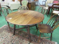 Ercol "Old Colonial" drop-side table with cross stretcher, 107cms diameter (open) x 71cms, with 4