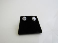 Diamond stud earrings, central diamond approx 0.4ct. Estimate £1,750-1,850