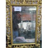 19th century gilt open scroll work framed wall mirror, 50cms x 36cms. Estimate £40-60
