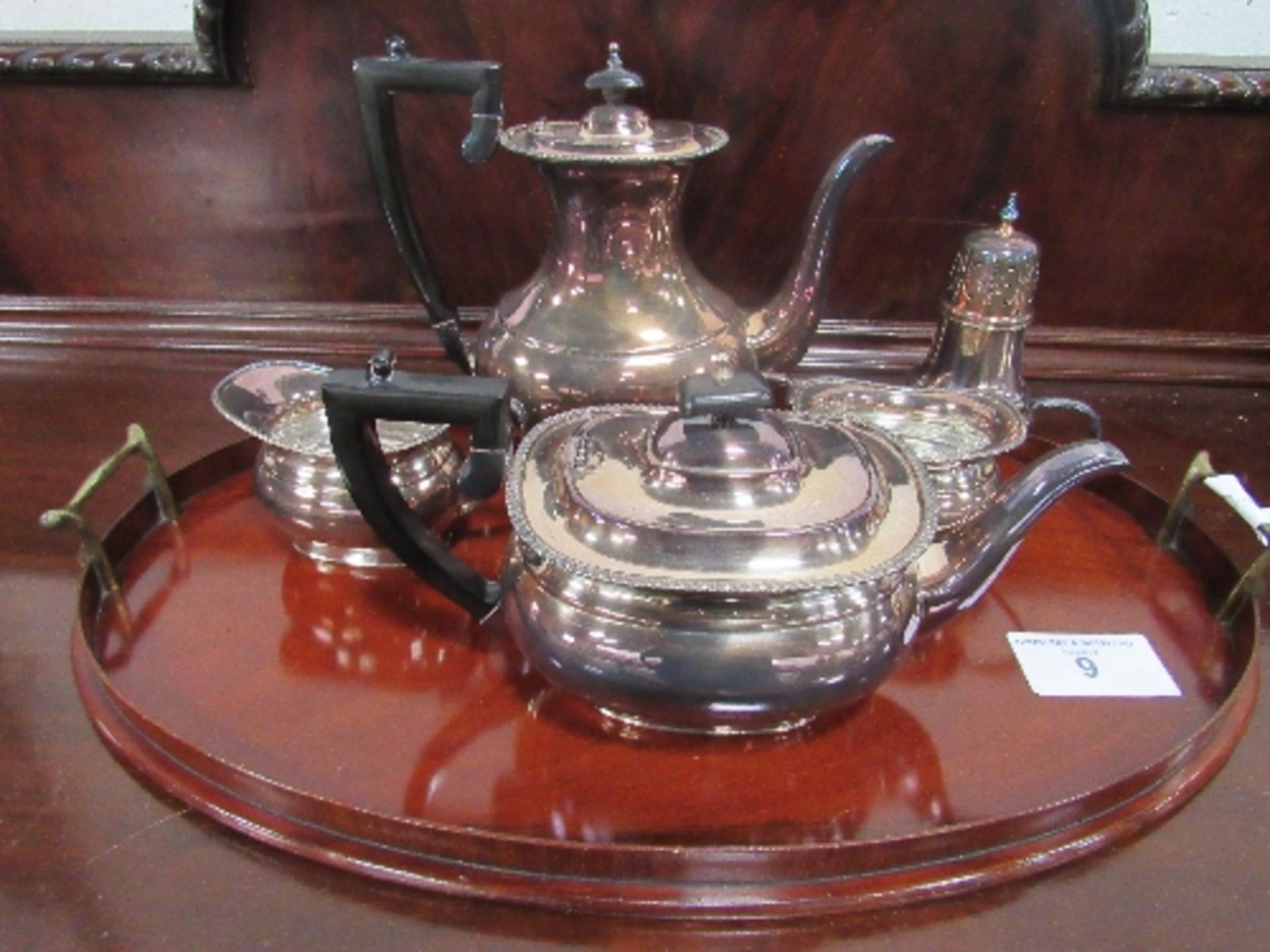 Silver plated tea service & sugar caster together with a mahogany oval shaped tray with inlay, brass
