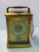 Large brass cased French carriage clock with visible escapement, marked R A, with Aiguilles