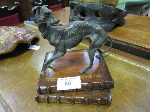 Metal sculptured Lurcher figure standing on wooden plinth of 2 books. Estimate £30-50