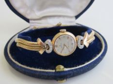 Rolex Precision lady's manual wrist watch in diamond mounted 18ct gold case & strap, going order, in
