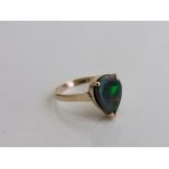14ct gold ring set with a tear drop shaped opal, size N, weight 3.2gms. Estimate £600-650