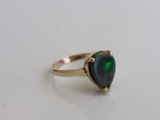 14ct gold ring set with a tear drop shaped opal, size N, weight 3.2gms. Estimate £600-650