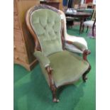 Victorian mahogany carved framed upholstered open armchair with spoon back on casters. Estimate £