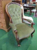 Victorian mahogany carved framed upholstered open armchair with spoon back on casters. Estimate £