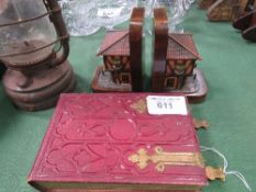 Red leather bound photograph album, pair of book ends and a hurricane lamp. Est 20-40