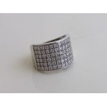 18ct white gold wide ring set with multiple small diamonds, size N½, weight 10gms. Estimate £1,000-