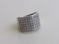 18ct white gold wide ring set with multiple small diamonds, size N½, weight 10gms. Estimate £1,000-