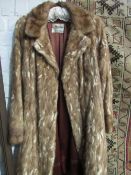 Long pale brown coloured fur coat from L Marks, Furrier, Wolverhampton. Estimate £20-30