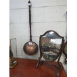 Copper long-handled bed warming pan together with a mahogany framed shield-shaped toilet mirror.