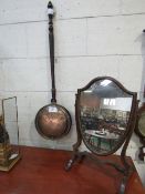 Copper long-handled bed warming pan together with a mahogany framed shield-shaped toilet mirror.