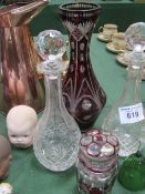 2 cut glass decanters, ruby cut to clear vase Ht 34cms, glass bell and ruby cut to clear lidded pot.