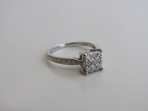 18ct white gold & diamond ring in square setting, 0.7cms x 0.7cms with diamonds to shoulders, size