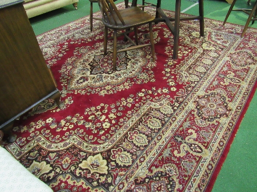 Large red ground rug, 308 x 249cms. Estimate £40-60