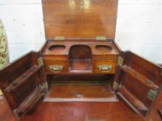 Mahogany smoker's cabinet with brass handles & carved door panels, 37 x 21 x 27cms. Estimate £30-50