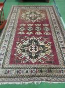 Dark red ground Turkish rug, 240 x 160cms. Estimate £20-30