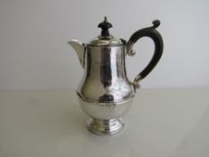 Silver coffee pot with wooden handle, hallmarked Birmingham 1931, weight 11oz, height 17.5cms.