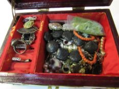 Oriental style box containing mixed costume jewellery. Estimate £10-20