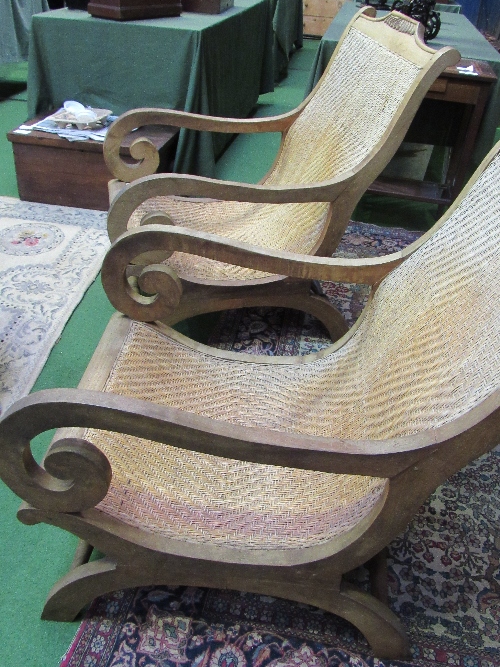 A pair of Indonesian hardwood & cane 'lazy chairs'. Estimate £80-100 - Image 4 of 5