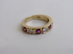 18ct gold band set with 4 rubies & 3 diamonds, size M, weight 6.1gms. Estimate £650-700