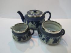 Wedgwood Jasper ware teapot, milk jug, and sugar bowl with silver rims, marked Chester 1908 (sugar