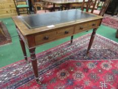 Mahogany table with leather inset, 2 drawers on tapered legs to casters, 107 x 55 x 74cms.