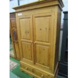 Pine double wardrobe over 2 drawers to base, 113 x 56 x 201cms. Estimate £40-60