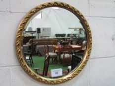 Circular bevel-edged gilt framed mirror, diameter 46cms. Estimate £20-30