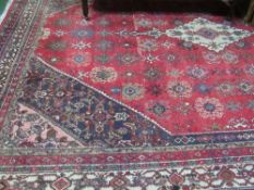 Red ground Iranian carpet, 277 x 366cms. Estimate £40-60