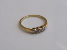 18ct gold ring with 3 diamonds, 0.33ct, size Q, weight 2.3gms. Estimate £80-100