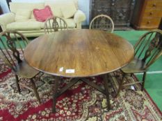 Ercol 'Old Colonial' drop side table with cross stretcher, 107cms diameter (open) x 71cms & 4