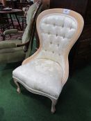 Beech framed cream upholstered slipper shaped bedroom chair. Estimate £20-30