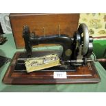 Pfaff sewing machine with a wooden box. Est £20-40 plus VAT on the hammer price