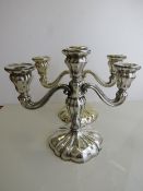 A pair of 3 branch silver candelabras, marked 830 with lion mark, height 23cms, Est £200-250